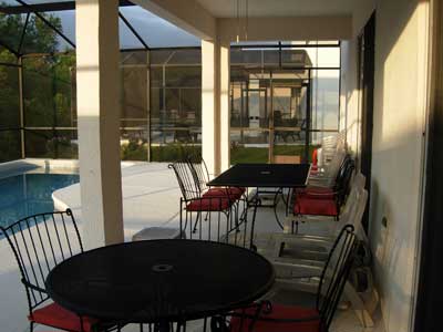 Relaxed seating area beside the pool.